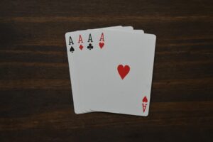 Pot Limit Omaha Rules table with chips and four hole cards