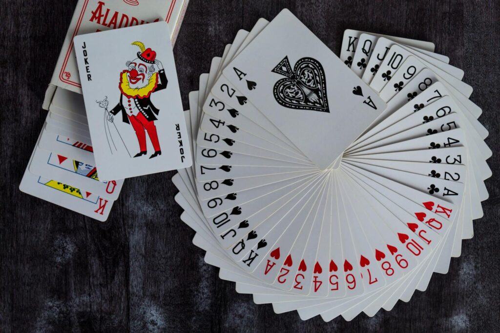 Poker table positioning with a deck of cards laid out in front, showcasing a strategic poker setup.
