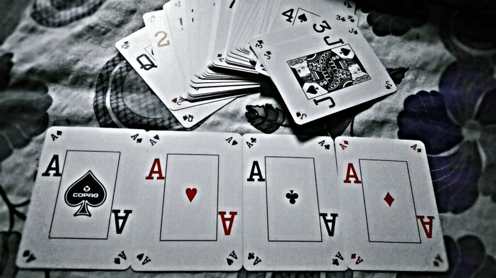 Poker player analyzing bankroll strategy at a modern casino table