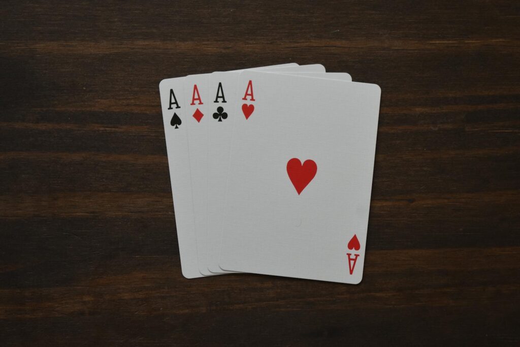 Pot Limit Omaha Rules table with chips and four hole cards