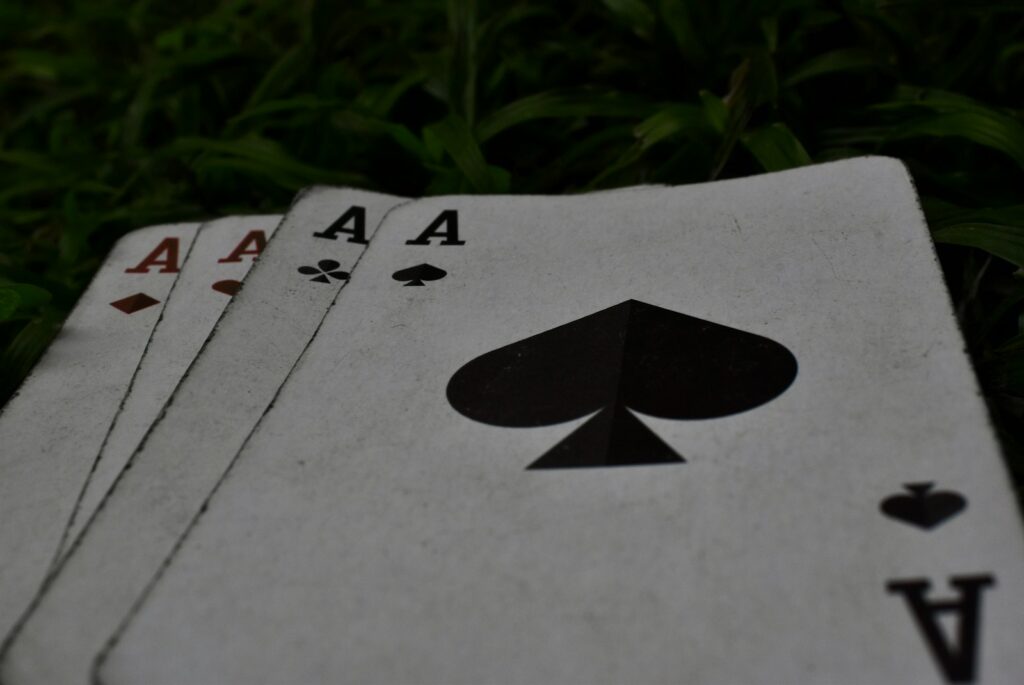 Poker cards with live poker strategy in action.