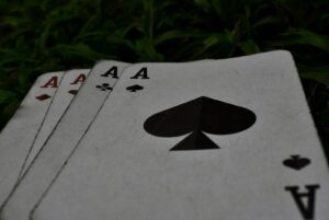 Poker cards with live poker strategy in action.