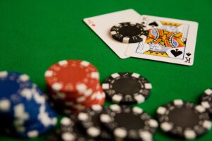 Poker Bluffing Tips A poker player bluffing confidently at the table during a high-stakes hand