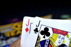 Poker strategy with a hand of jacks of diamonds and clubs in play.