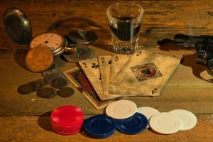 Poker Omaha strategy with four hole cards and chips on table